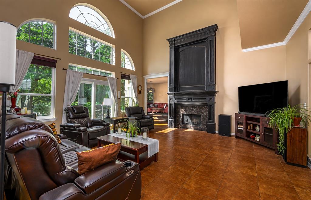 100 Manders Court Runaway Bay, TX 76426 - Photo 7 of 33 a living room with fireplace furniture and a flat screen tv