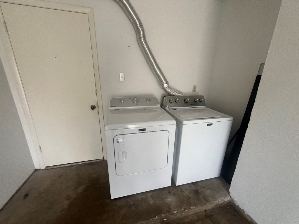 807 Lloyd Lane, Unit A Elgin, TX 78621 - Photo 12 of 16 Washroom featuring concrete floors and washing machine and clothes dryer