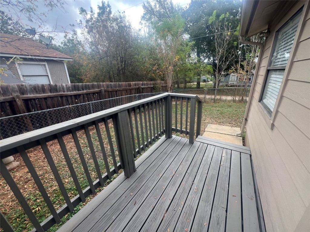 807 Lloyd Lane, Unit A Elgin, TX 78621 - Photo 15 of 16 Wooden terrace featuring a fenced backyard