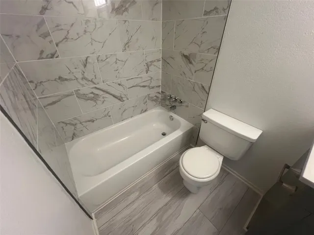 wooden floor in an empty room with a mirror