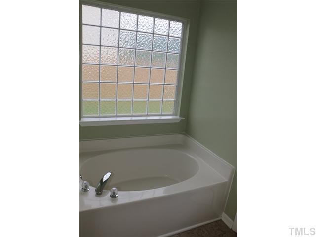 3333 Deering Drive Raleigh, NC 27616 - Photo 8 of 10 a bathroom with a tub