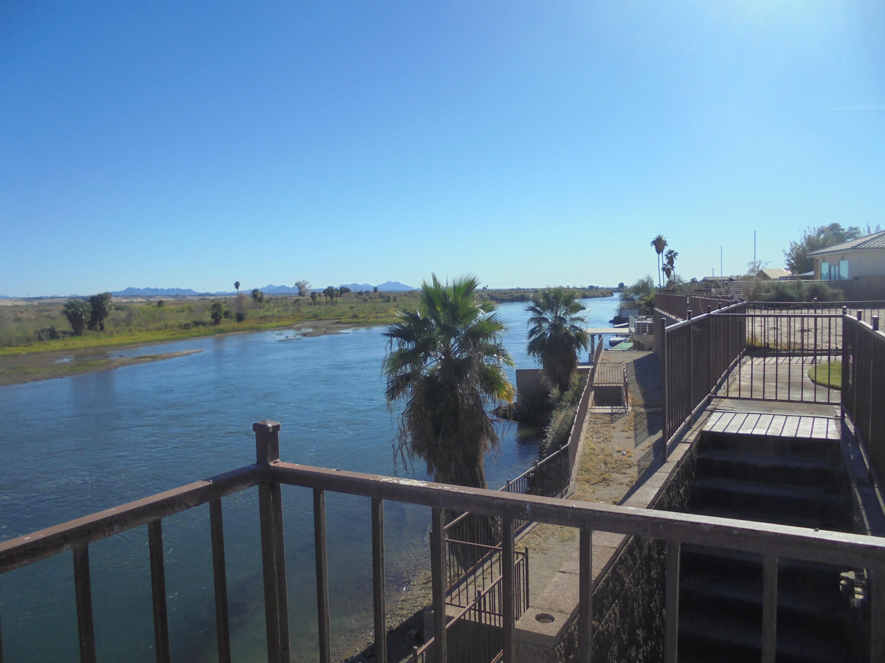 654 Riviera Drive Blythe, CA 92225 - Photo 12 of 39 a view of a balcony with wooden floor and lake view