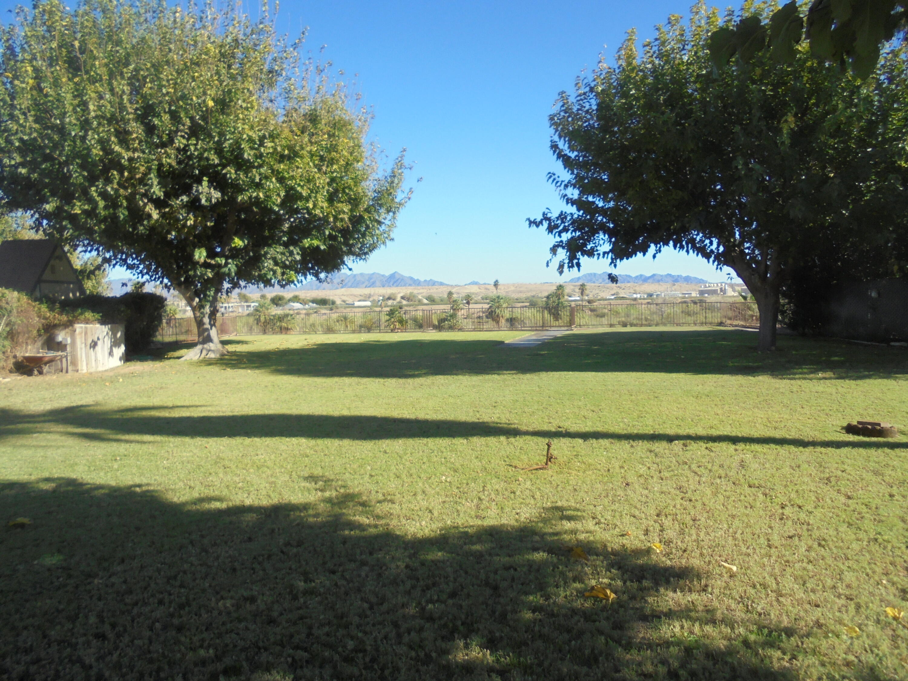 654 Riviera Drive Blythe, CA 92225 - Photo 21 of 39 a view of an ocean and a yard