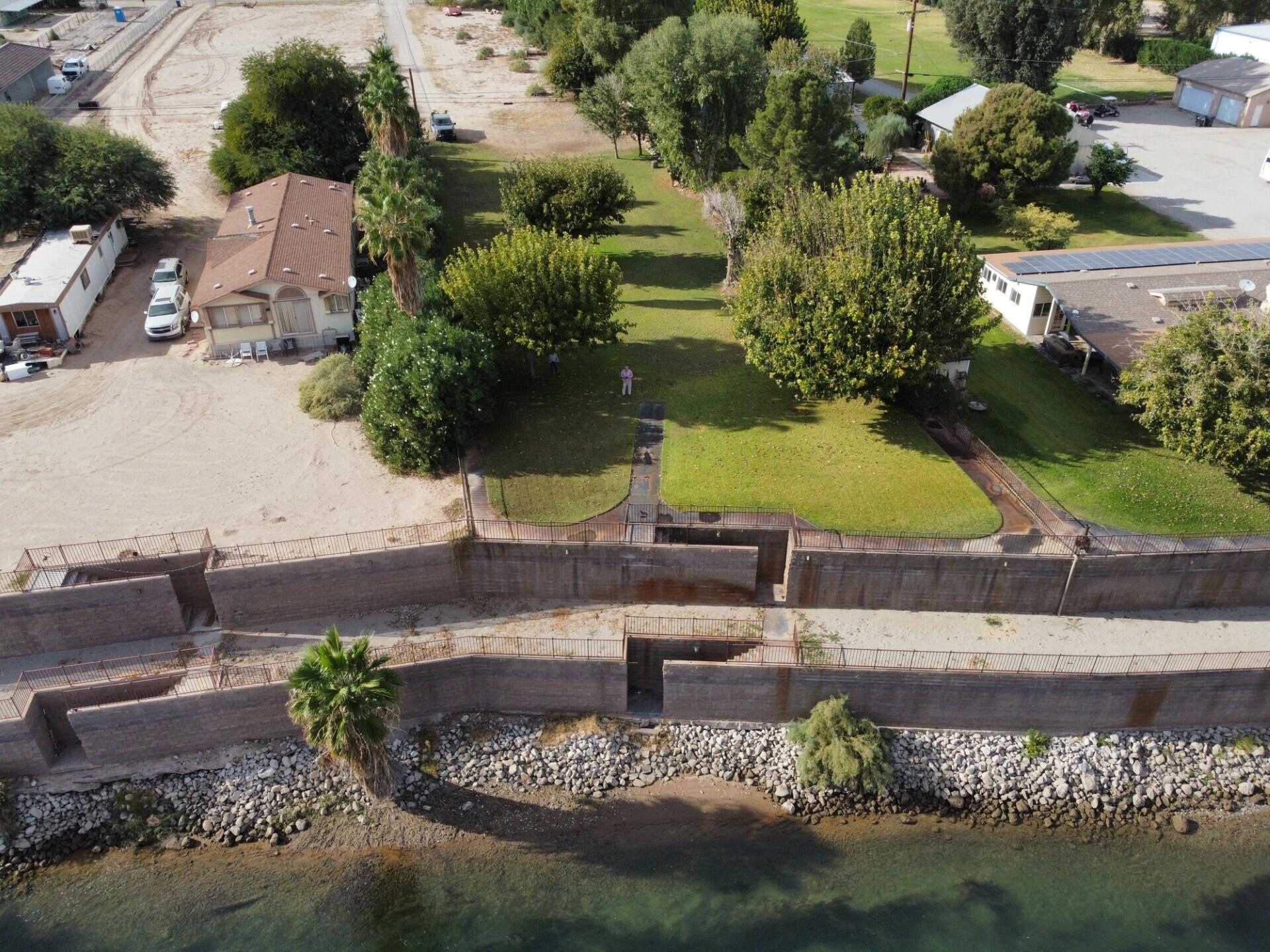 654 Riviera Drive Blythe, CA 92225 - Photo 35 of 39 an aerial view of a house with garden space lake view and lake view