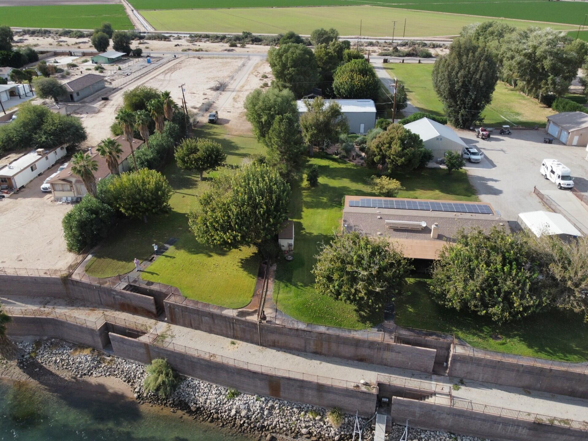 654 Riviera Drive Blythe, CA 92225 - Photo 36 of 39 an aerial view of a house with a yard and potted plants