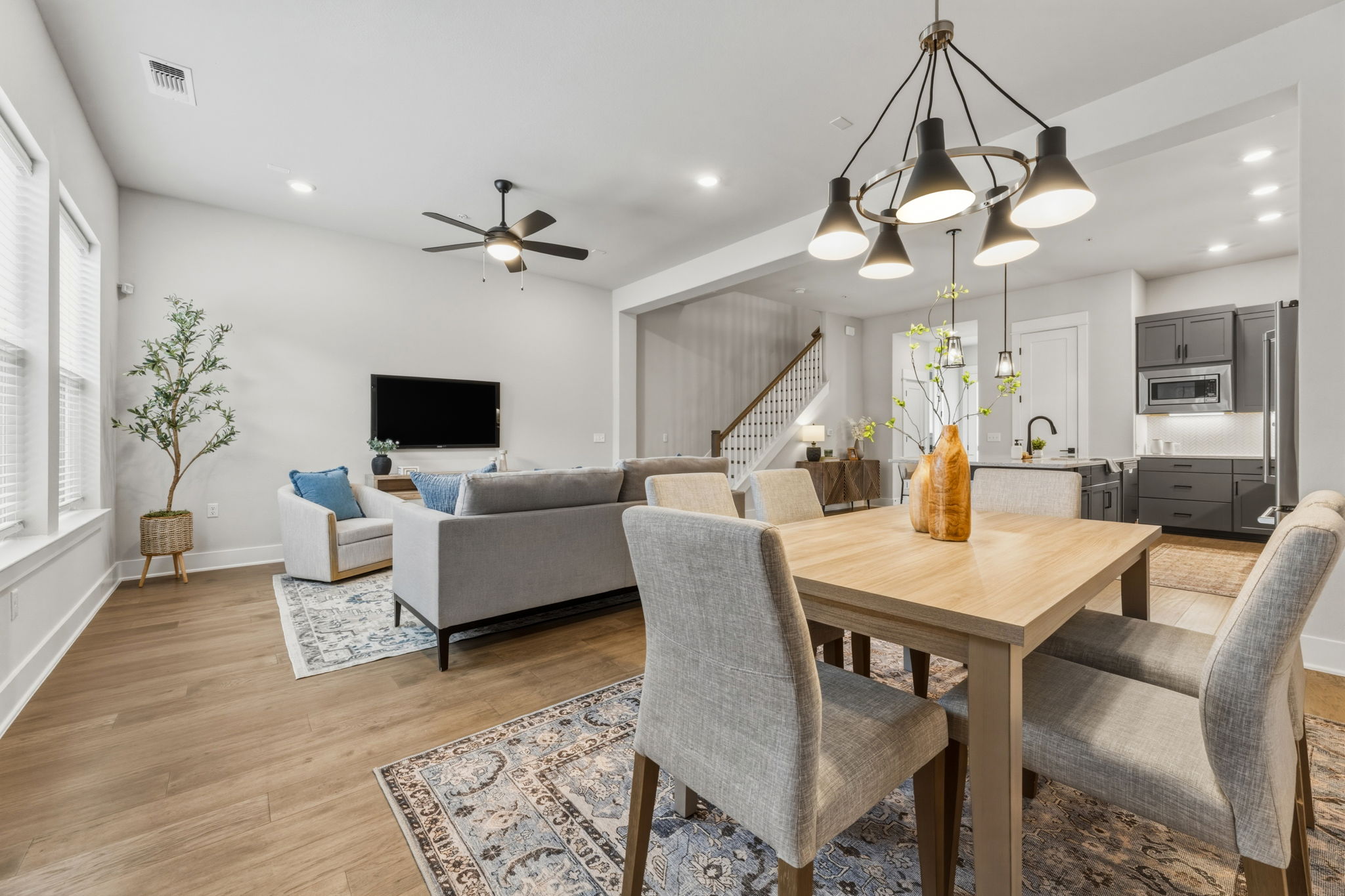 2929 Moreno Street Austin, TX 78723 - Photo 16 of 40 Open-concept living space featuring wood-finish flooring, recessed lighting, and a modern ceiling fan