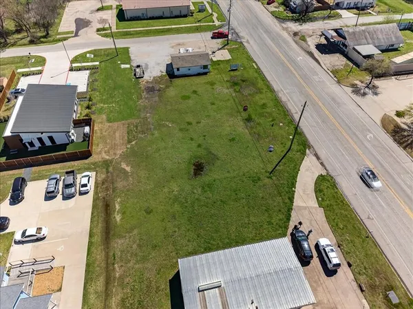 an aerial view of a house with outdoor space
