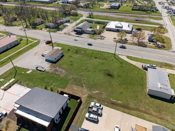a view of a balcony with two chairs and a table