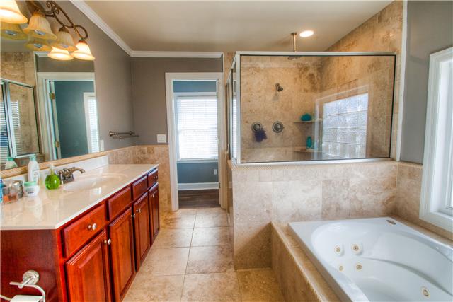 1210 Palmer Road Lebanon, TN 37090 - Photo 15 of 20 a bathroom with a bathtub and a sink