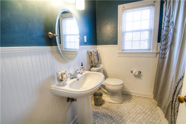 1210 Palmer Road Lebanon, TN 37090 - Photo 18 of 20 a bathroom with a sink a toilet and a mirror