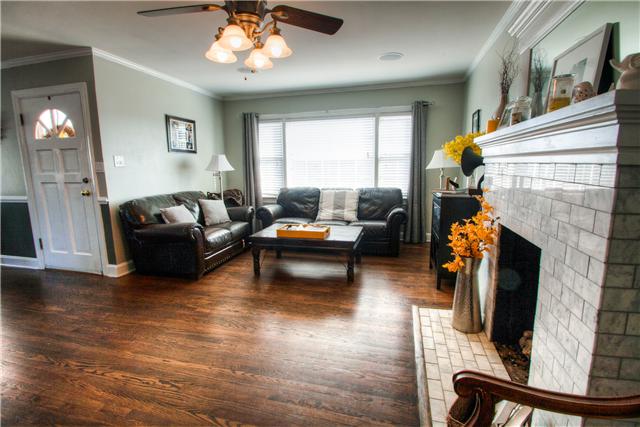 1210 Palmer Road Lebanon, TN 37090 - Photo 3 of 20 a living room with furniture a fireplace and a flat screen tv