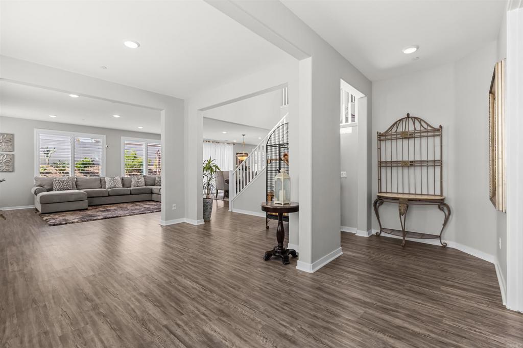 29809 Gypsy Vanner Way Menifee, CA 92584 - Photo 3 of 45 a view of a livingroom with furniture and hardwood floor