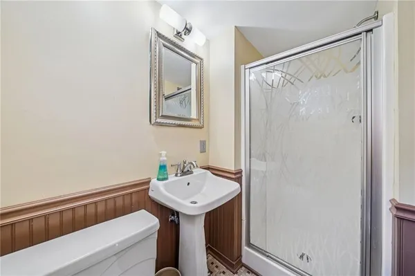 a bathroom with a sink and shower