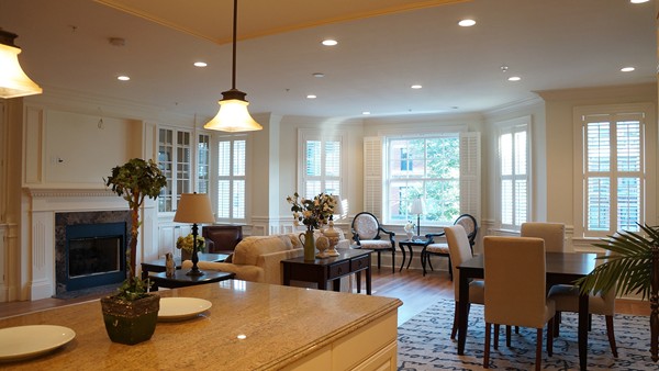 447 Beacon Street, Unit 3 Boston, MA 02115 - Photo 4 of 7 a living room with furniture a fireplace and a chandelier