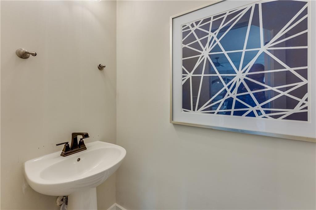 76 Mayson Avenue Northeast, Unit B Atlanta, GA 30307 - Photo 11 of 40 a bathroom with a sink and mirror