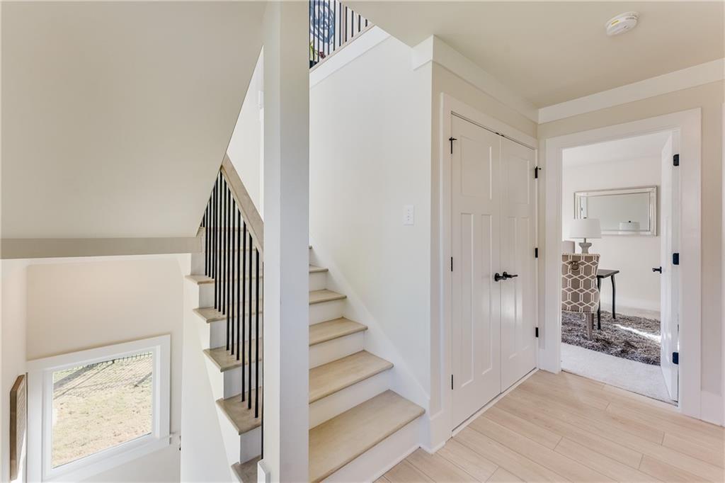 76 Mayson Avenue Northeast, Unit B Atlanta, GA 30307 - Photo 12 of 40 a view of a hallway with wooden floor and entryway