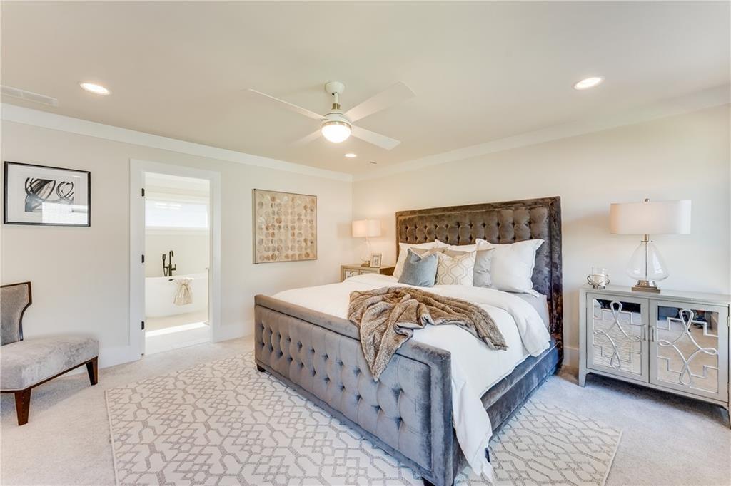 76 Mayson Avenue Northeast, Unit B Atlanta, GA 30307 - Photo 13 of 40 a bed room with a bed and a couch