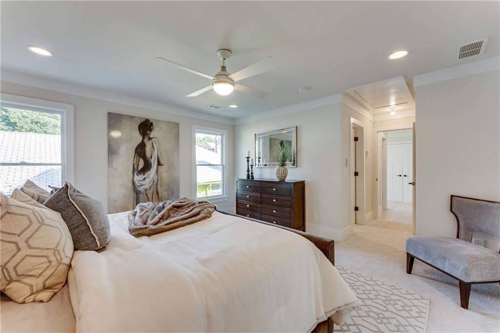 76 Mayson Avenue Northeast, Unit B Atlanta, GA 30307 - Photo 15 of 40 a bedroom with a bed and wooden floor