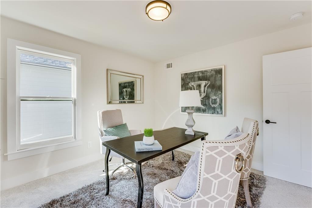 76 Mayson Avenue Northeast, Unit B Atlanta, GA 30307 - Photo 30 of 40 a view of a workspace with furniture and a window