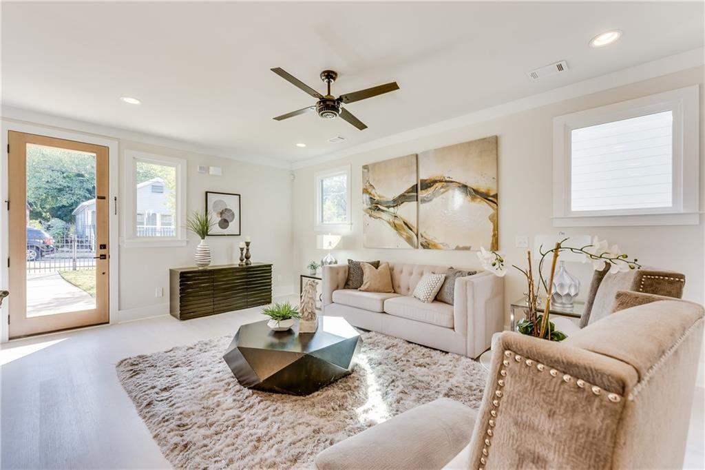 76 Mayson Avenue Northeast, Unit B Atlanta, GA 30307 - Photo 3 of 40 a living room with furniture and a wooden floor