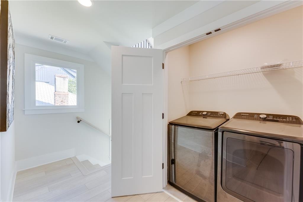 76 Mayson Avenue Northeast, Unit B Atlanta, GA 30307 - Photo 32 of 40 a utility room with dryer and washer