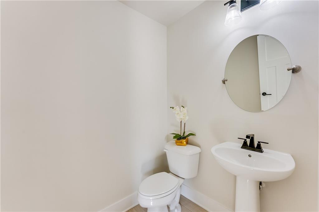 76 Mayson Avenue Northeast, Unit B Atlanta, GA 30307 - Photo 34 of 40 a bathroom with a sink and a mirror