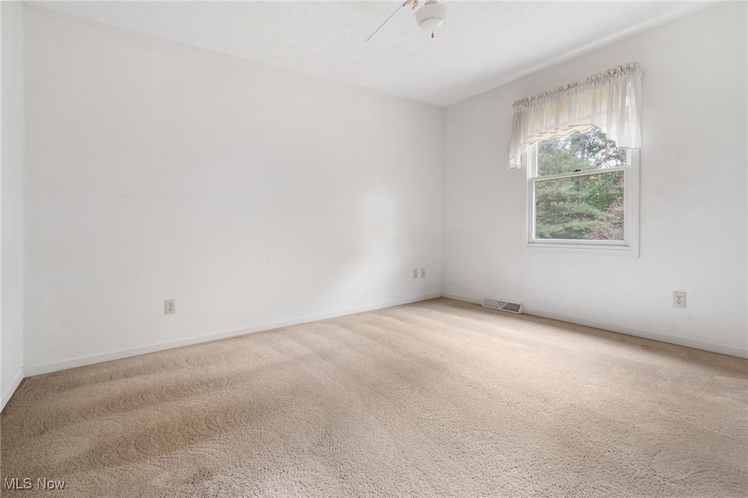 4057 Etter Road Mogadore, OH 44260 - Photo 26 of 41 Spare room featuring carpet