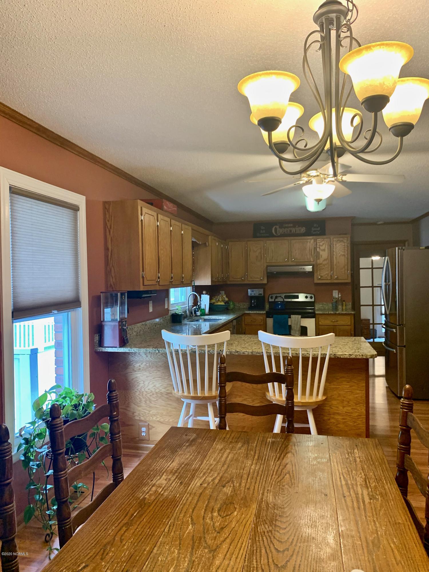 5036 Mill Branch Road Northwest Ash, NC 28420 - Photo 18 of 31 Spacious kitchen/dining area with access to laundry room and rear deck.