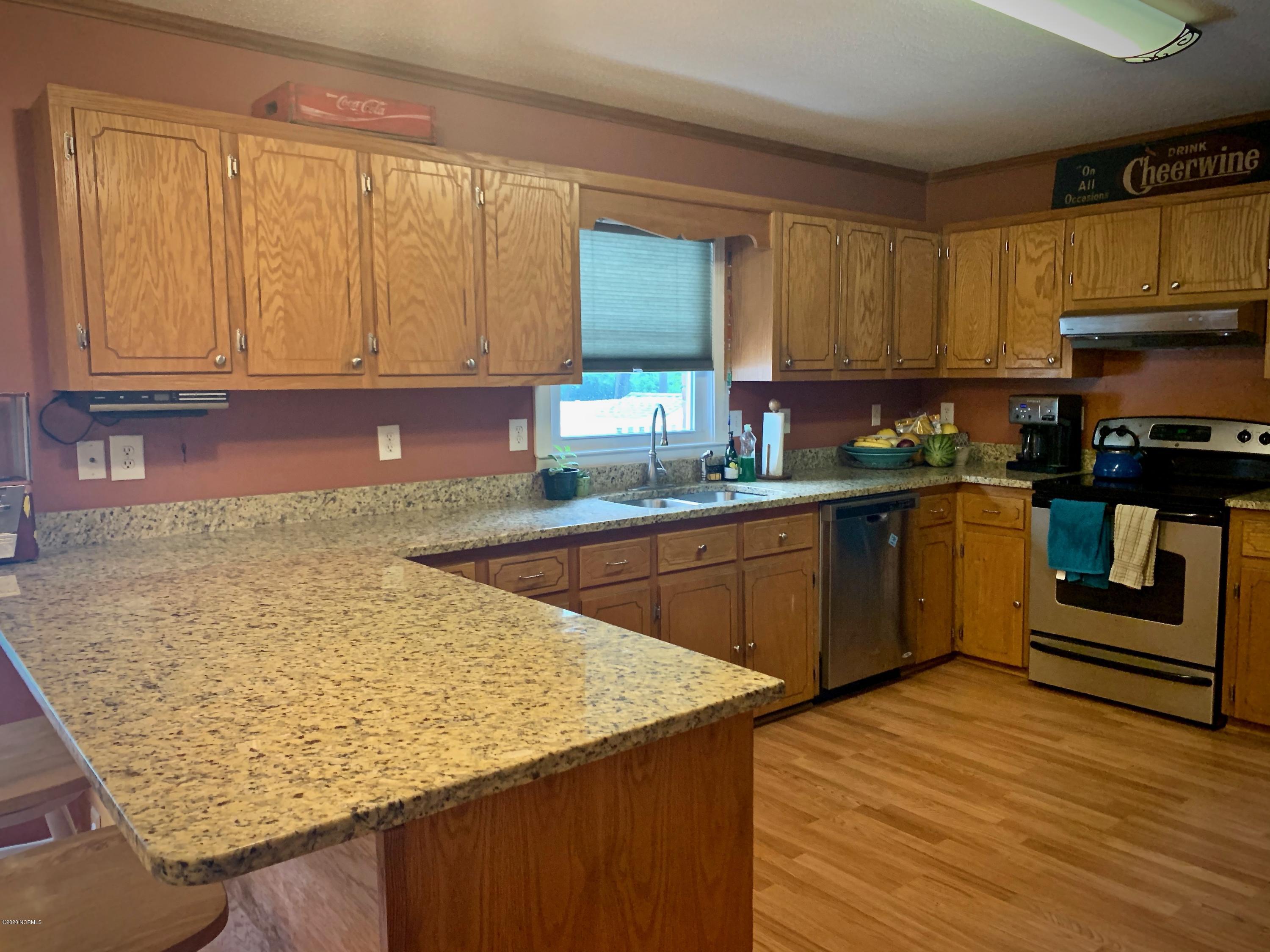 5036 Mill Branch Road Northwest Ash, NC 28420 - Photo 19 of 31 Granite countertops with ss appliances. Refrigerator is negotiable.