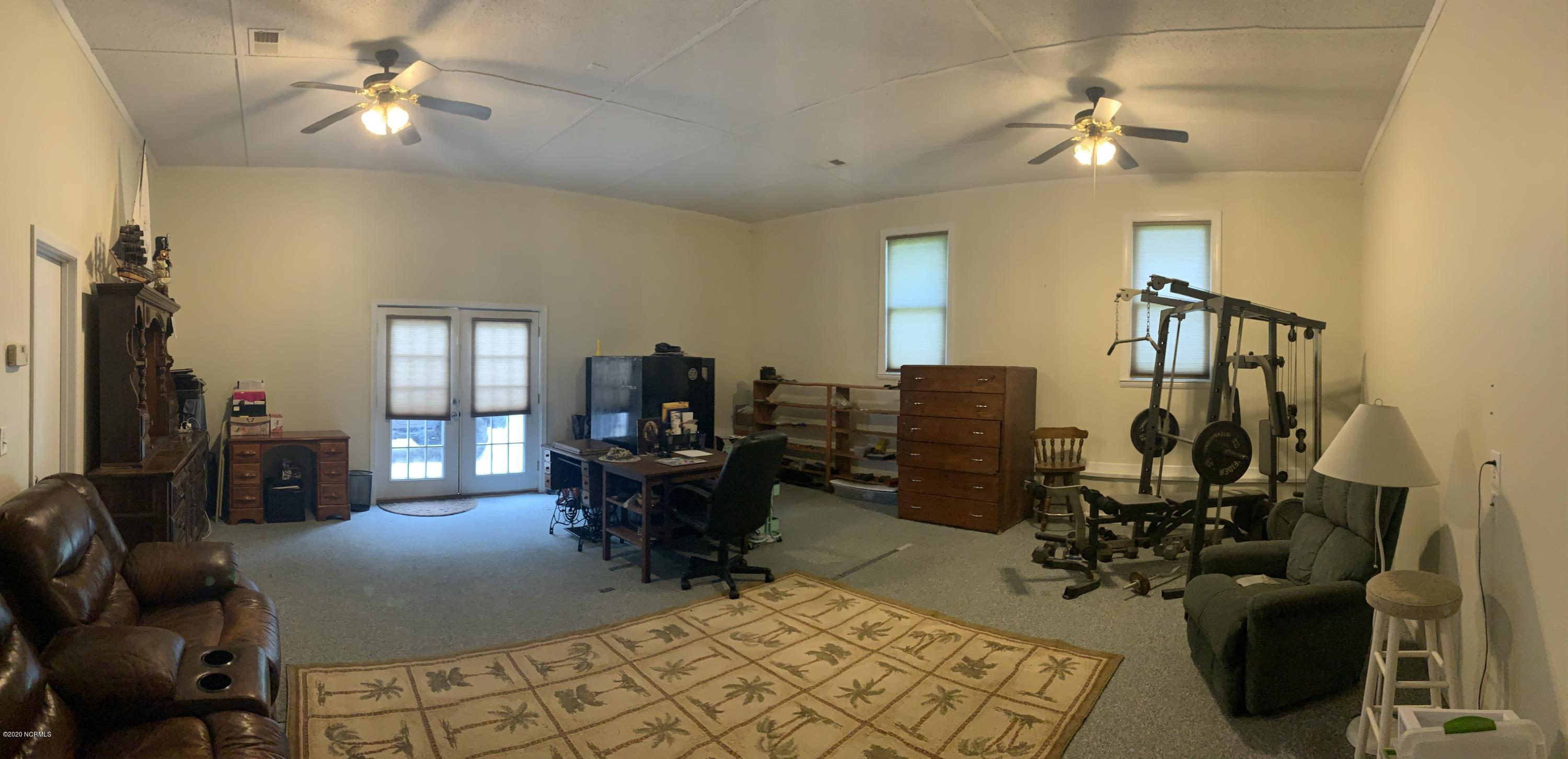 5036 Mill Branch Road Northwest Ash, NC 28420 - Photo 21 of 31 Large spacious room off of kitchen includes oversized storage room.