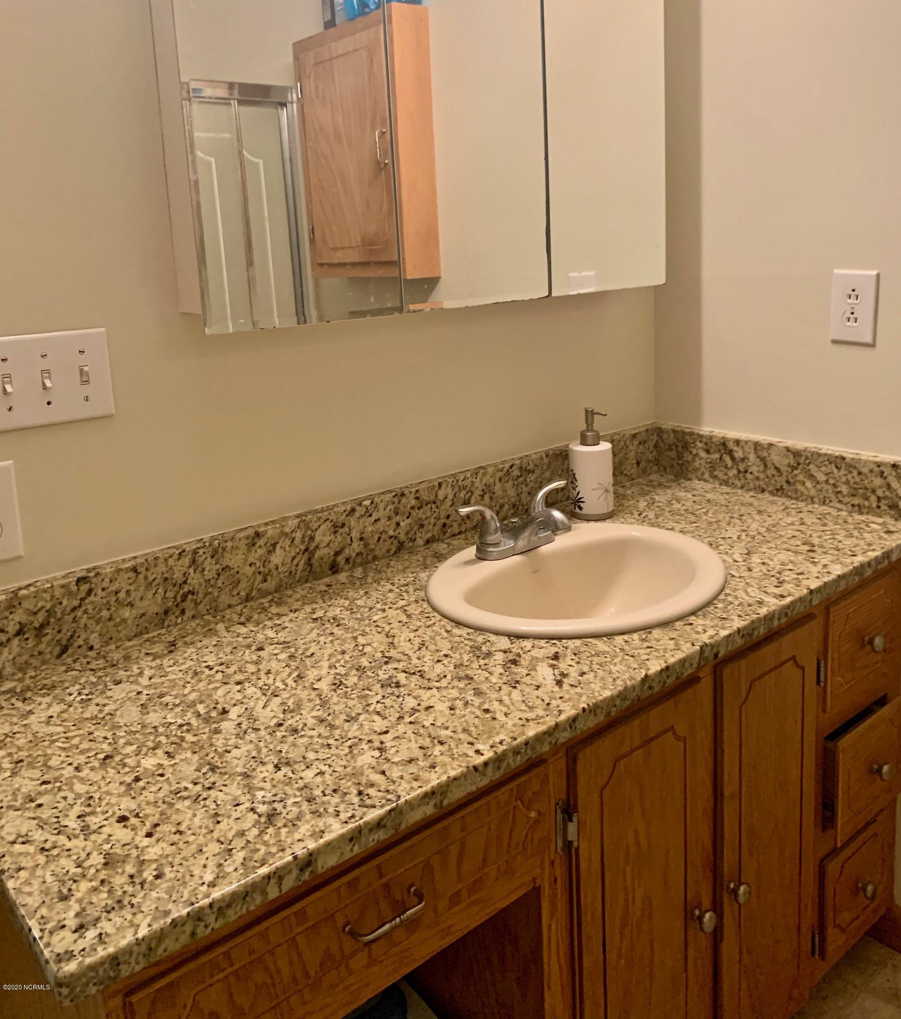 5036 Mill Branch Road Northwest Ash, NC 28420 - Photo 26 of 31 Primary bathroom.