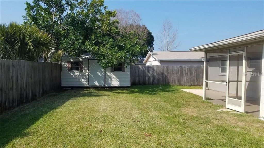 3538 Garfield Drive Holiday, FL 34691 - Photo 15 of 16 a backyard of a house