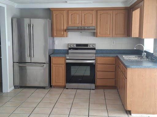 3538 Garfield Drive Holiday, FL 34691 - Photo 9 of 16 a kitchen with appliances cabinets and a counter top space