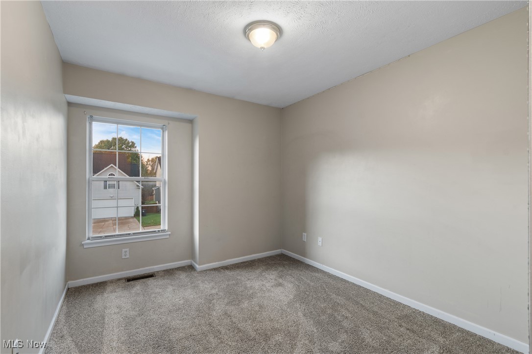 1333 Derbydale Road Akron, OH 44306 - Photo 20 of 29 Bedroom 3 with large window and neutral carpet