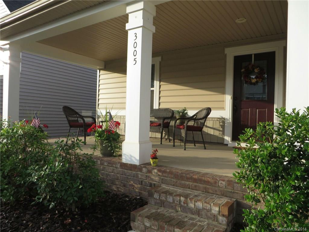 3005 Fallondale Road Waxhaw, NC 28173 - Photo 2 of 20 a view of a patio with table and chairs potted plants and floor to ceiling window