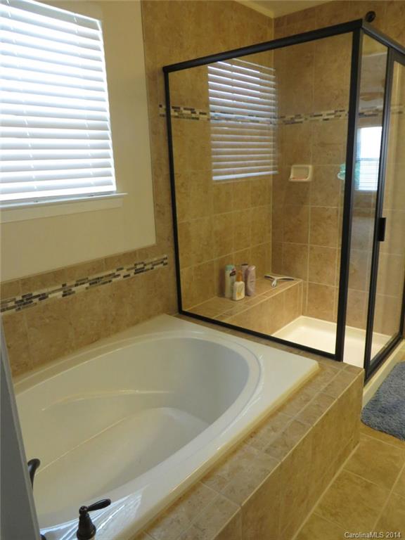 3005 Fallondale Road Waxhaw, NC 28173 - Photo 11 of 20 a bath tub sitting next to a shower