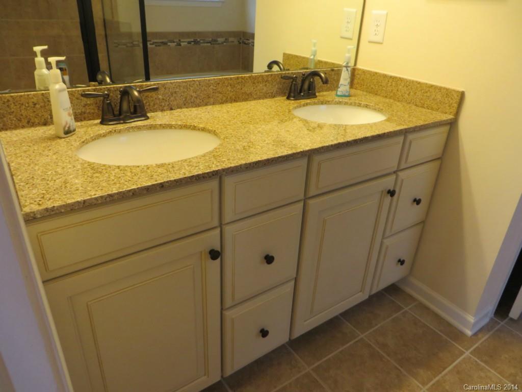 3005 Fallondale Road Waxhaw, NC 28173 - Photo 12 of 20 a bathroom with a granite countertop sink and a mirror