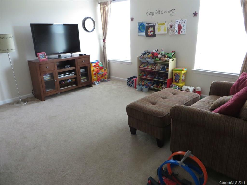 3005 Fallondale Road Waxhaw, NC 28173 - Photo 16 of 20 a living room with furniture and a flat screen tv