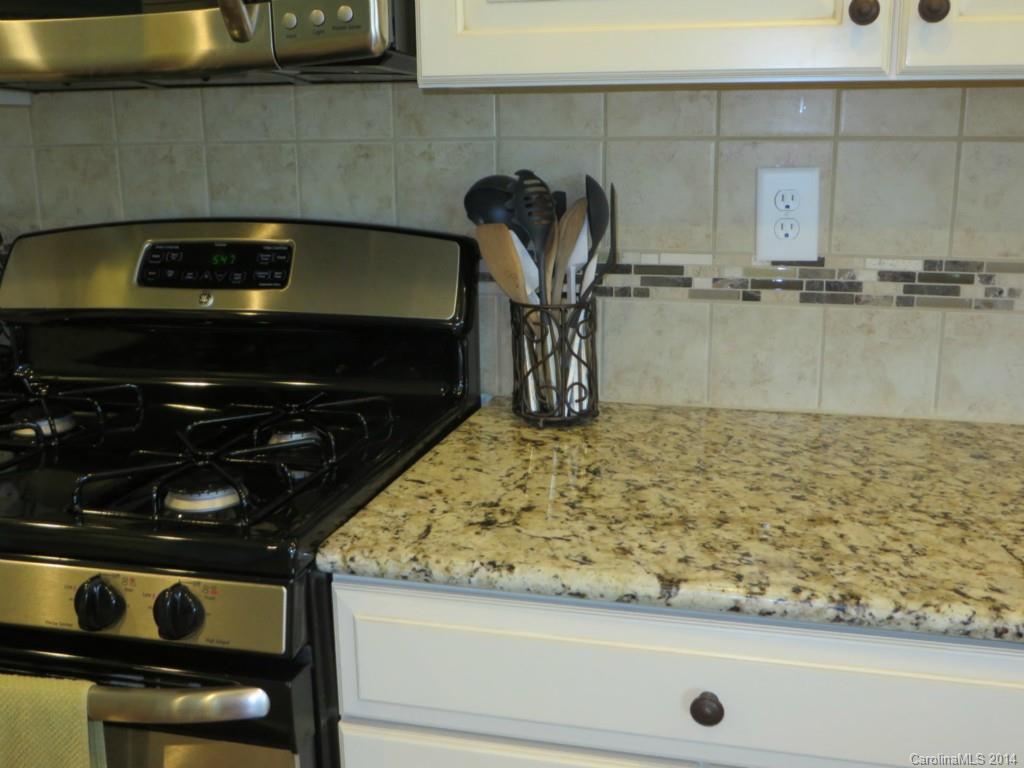 3005 Fallondale Road Waxhaw, NC 28173 - Photo 8 of 20 a kitchen with a stove and a microwave