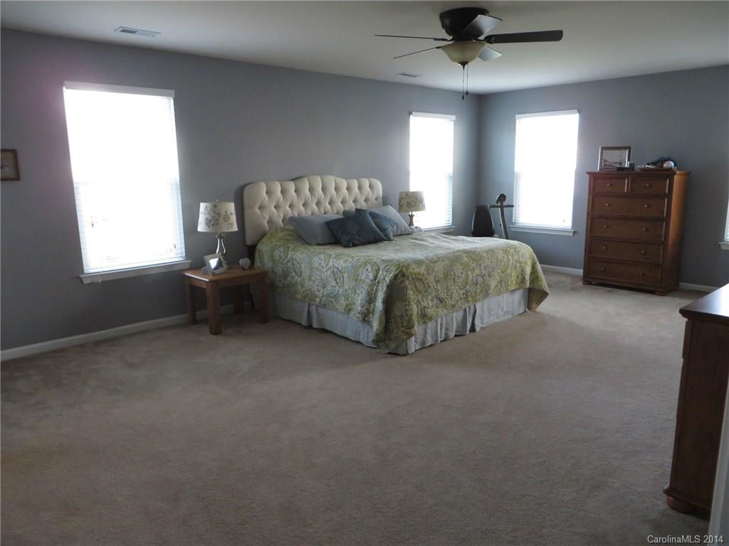 3005 Fallondale Road Waxhaw, NC 28173 - Photo 10 of 20 a spacious bedroom with a bed and a television