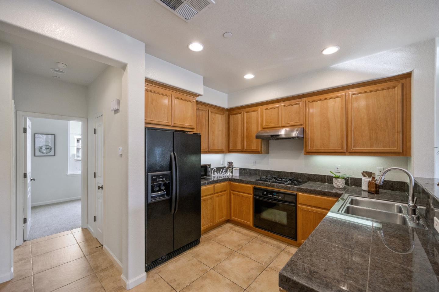 4517 Lick Mill Boulevard Santa Clara, CA 95054 - Photo 13 of 38 a kitchen with granite countertop stainless steel appliances and cabinets