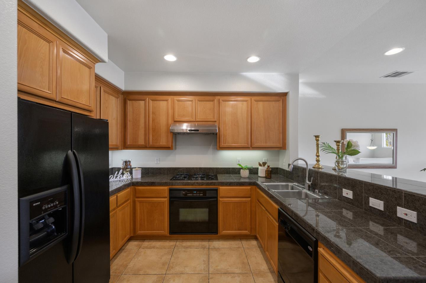 4517 Lick Mill Boulevard Santa Clara, CA 95054 - Photo 14 of 38 a kitchen with a sink a refrigerator and cabinets