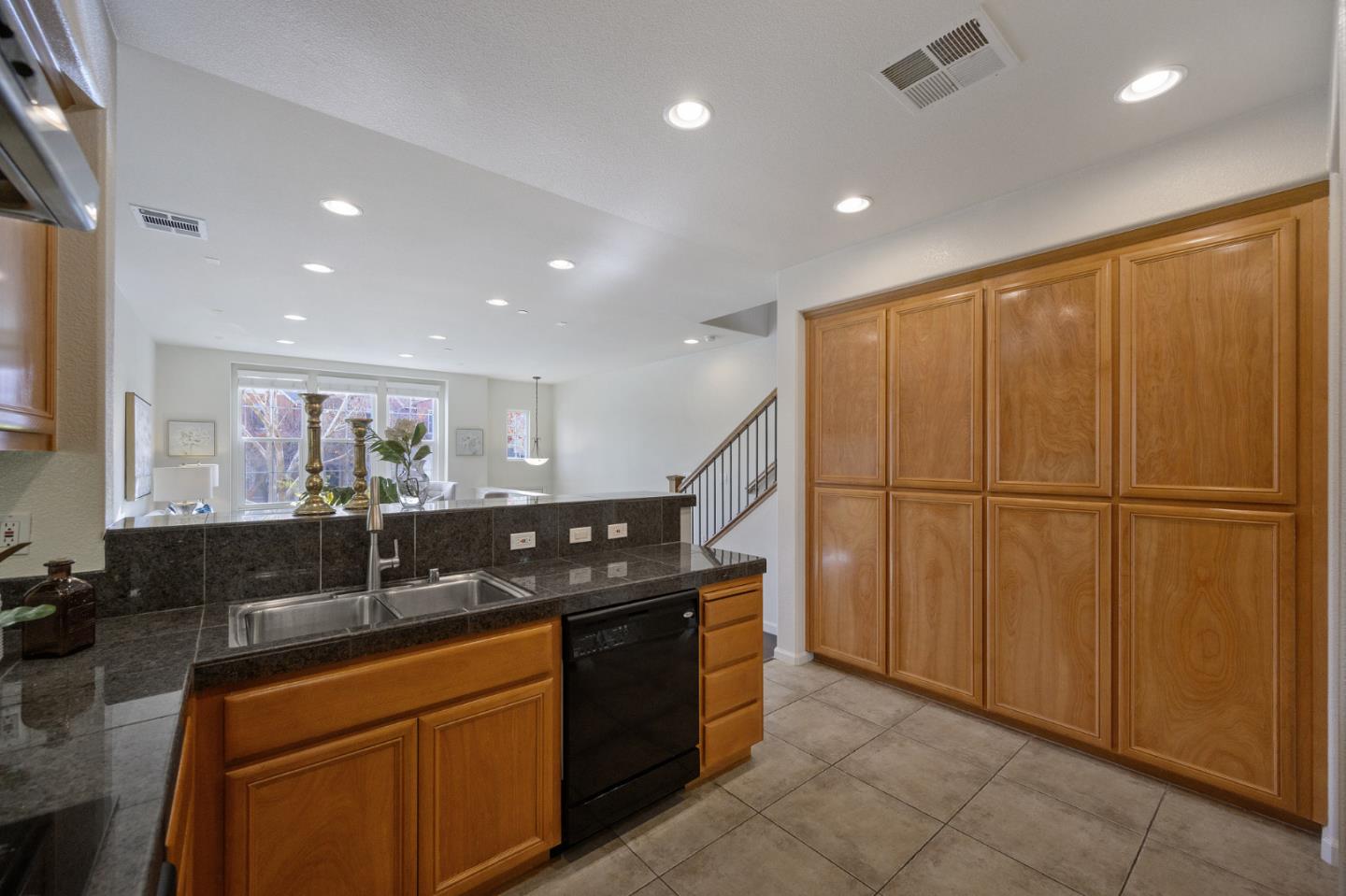 4517 Lick Mill Boulevard Santa Clara, CA 95054 - Photo 15 of 38 a kitchen with stainless steel appliances granite countertop a sink a stove a refrigerator and cabinets
