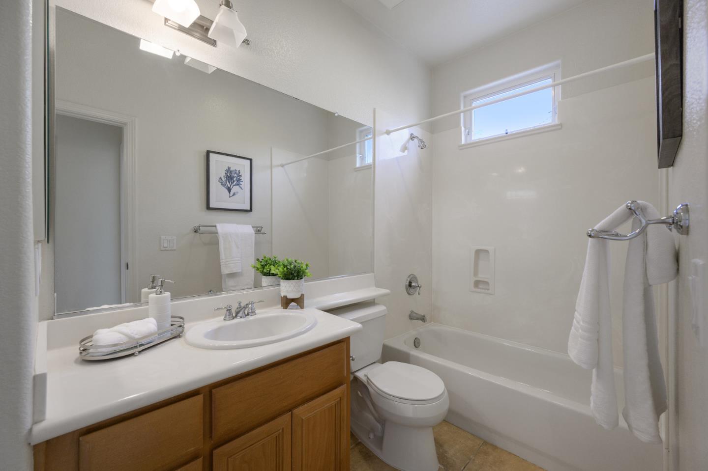 4517 Lick Mill Boulevard Santa Clara, CA 95054 - Photo 19 of 38 a bathroom with a granite countertop sink toilet and shower