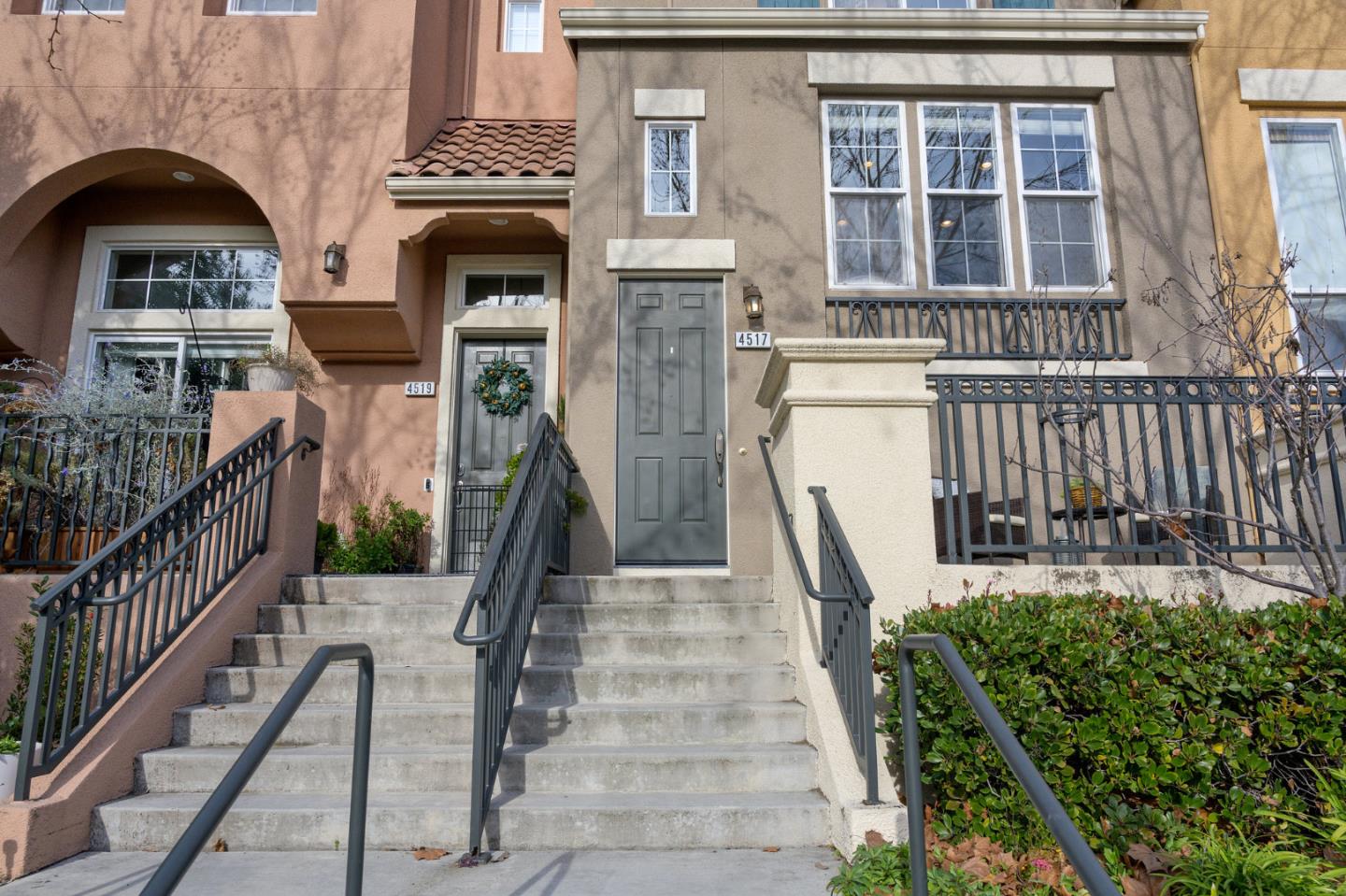 4517 Lick Mill Boulevard Santa Clara, CA 95054 - Photo 3 of 38 a view of a brick house with a large windows and a flower garden