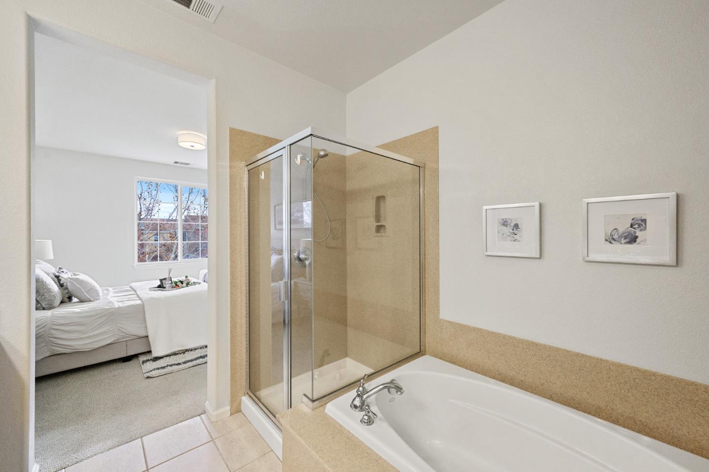 4517 Lick Mill Boulevard Santa Clara, CA 95054 - Photo 34 of 38 a bathroom with a tub shower and sink