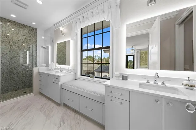a utility room with sink dryer and washer
