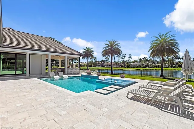 a view of a swimming pool with a patio