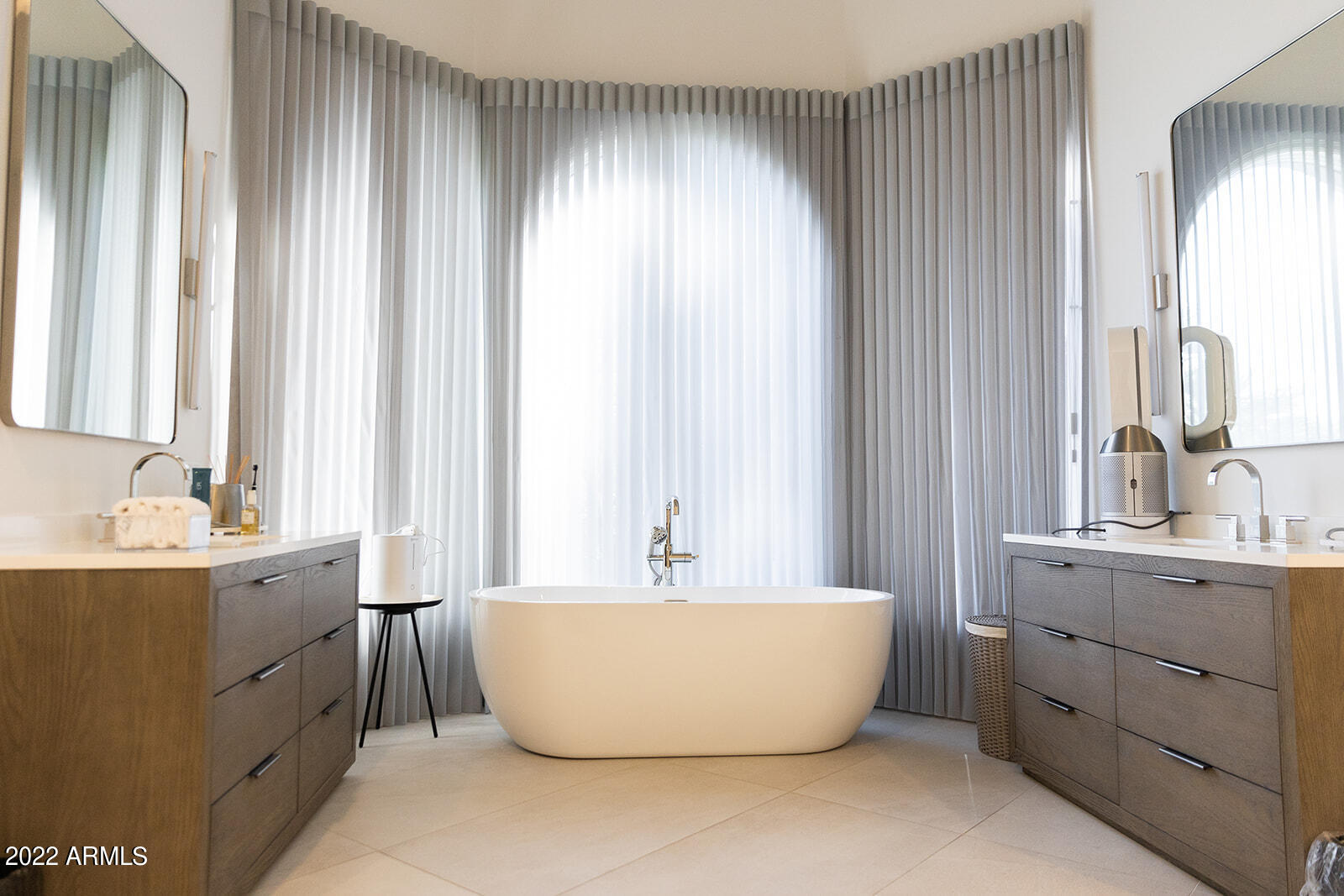 6271 East Horseshoe Road Paradise Valley, AZ 85253 - Photo 11 of 16 a white bath tub sitting in a bathroom next to a window