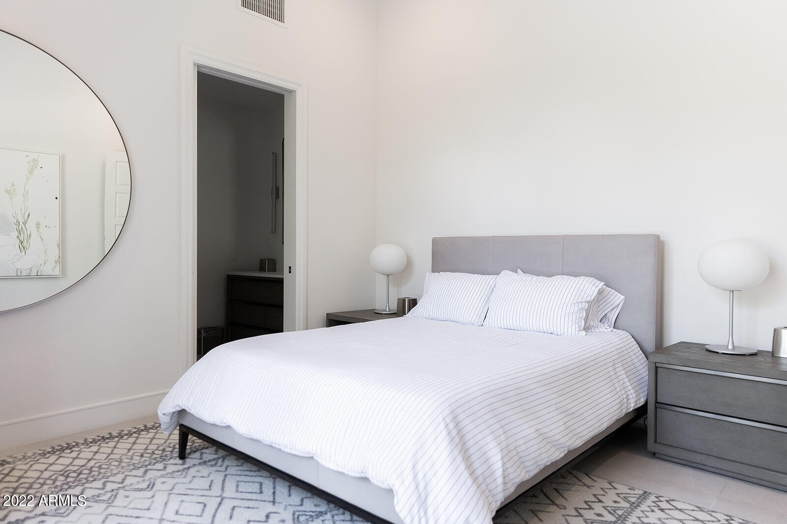 6271 East Horseshoe Road Paradise Valley, AZ 85253 - Photo 12 of 16 a bedroom with a bed and a mirror